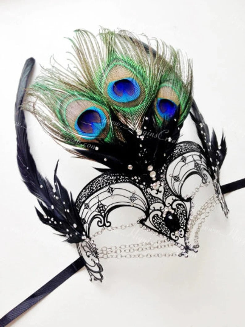 Black filigree mask with rhinestones and peacock feathers, ideal for prom, Mardi Gras, and masquerade ball.