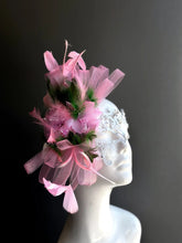 Elegant white lace masquerade mask with pink feathers and rhinestones for women’s prom, carnival, and party looks.