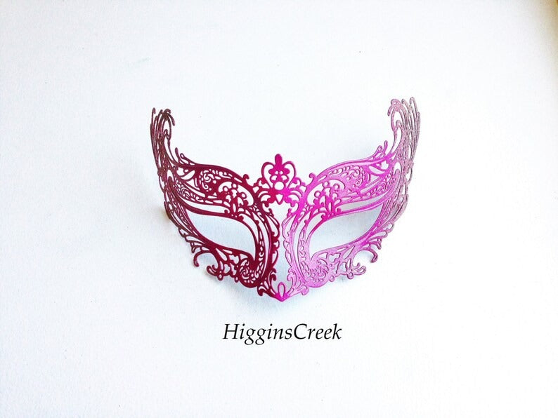 Ombre masquerade mask in metallic pink and purple filigree cut-out design.