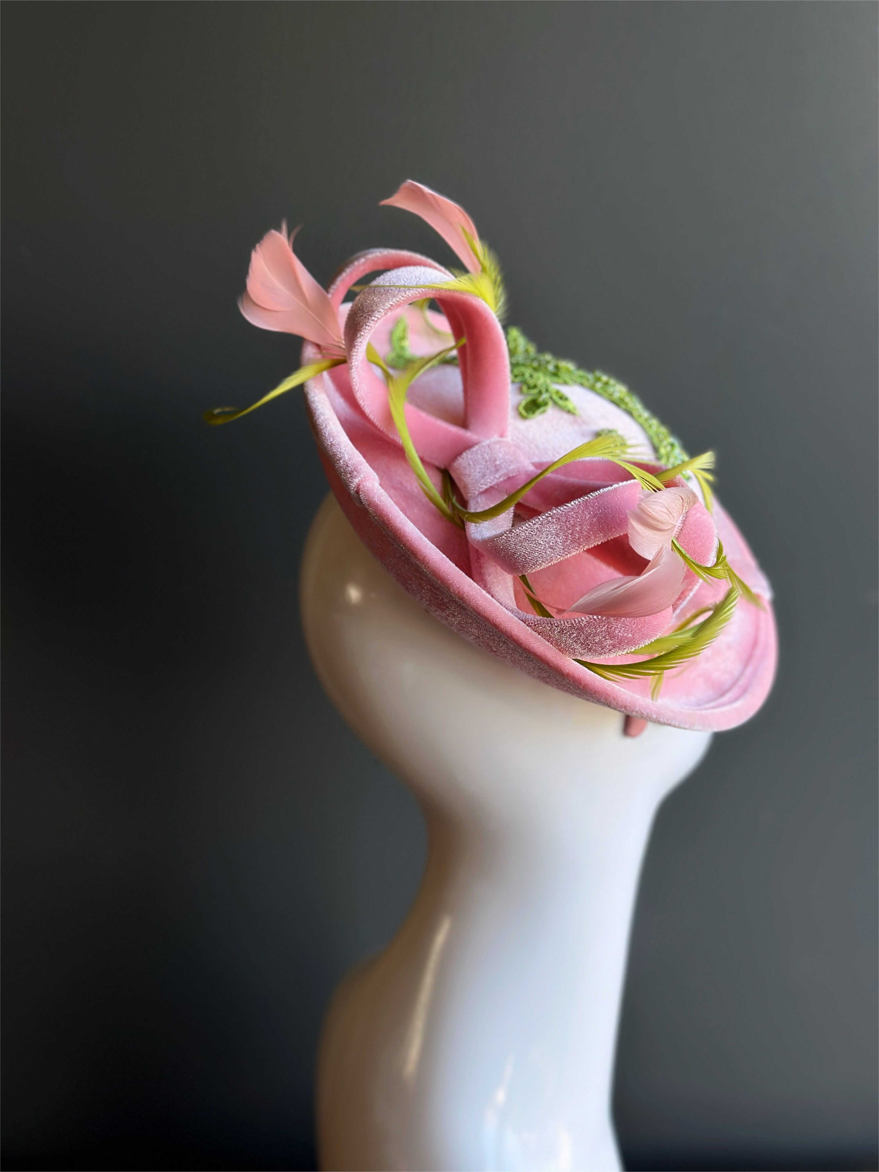 Velvet tea party fascinator hat with green beaded accents.