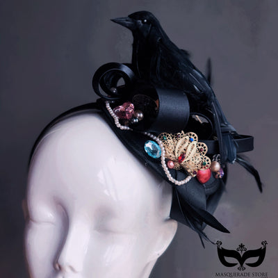 Black raven fascinator hat with jewels, pearls, and feathers
