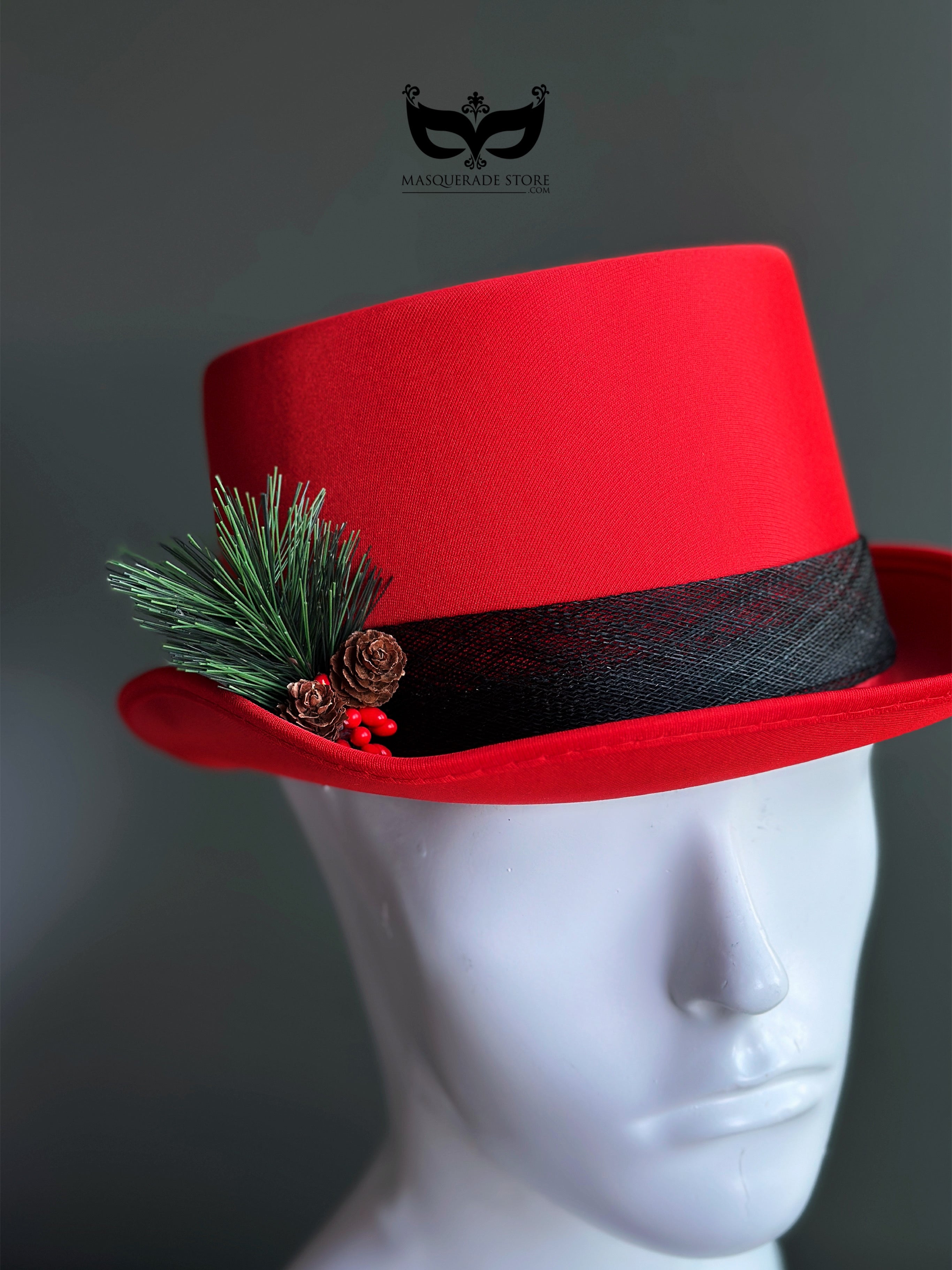 Red Christmas top hat with pine greenery pinecone accent for holiday outfits and winter parties