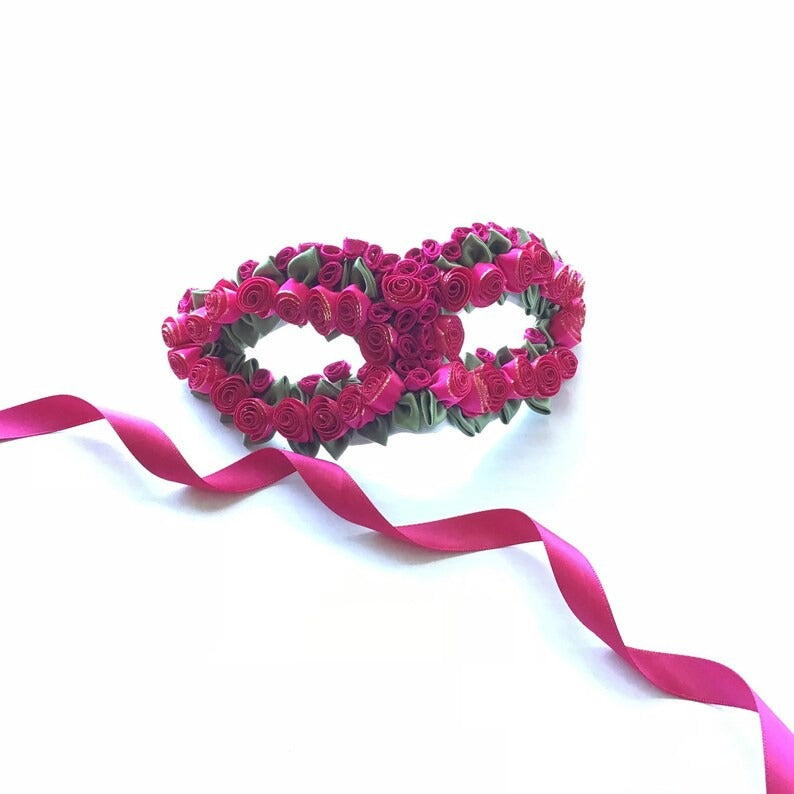 Hot pink rose bouquet masquerade mask with floral design and green leaf accents for women.
