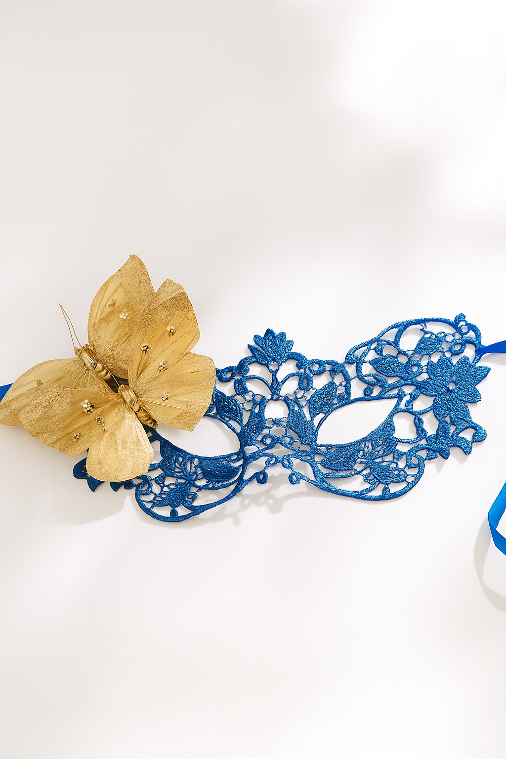 Royal blue lace masquerade mask with gold butterfly accent, elegant lace mask for women, perfect for prom, masquerade parties, and costume events.