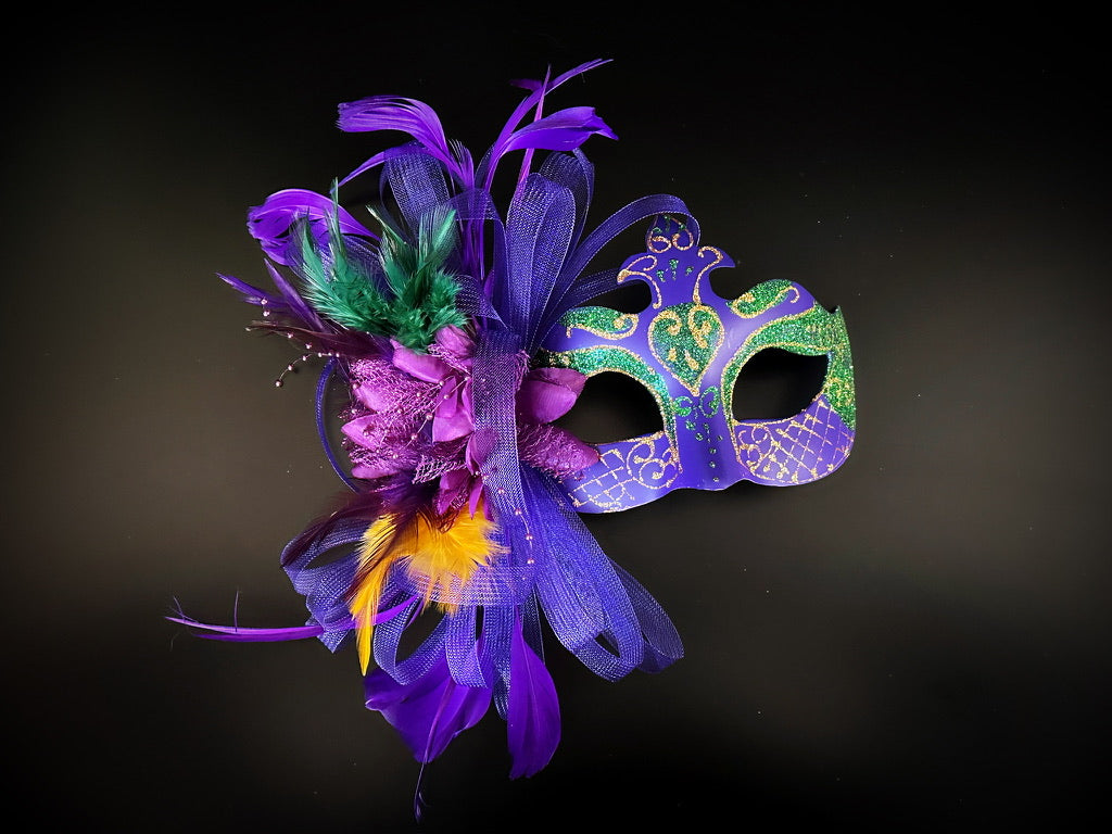 Elegant couples Mardi Gras mask set with purple, gold, and green designs, adorned glitter, feathers, and tulle.
