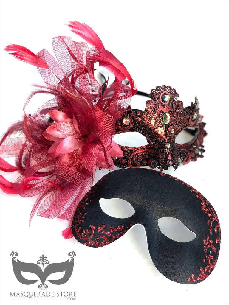 Elegant red and black masquerade mask set with a feathered rhinestone mask for women and a sleek filigree mask for men, perfect for couples.