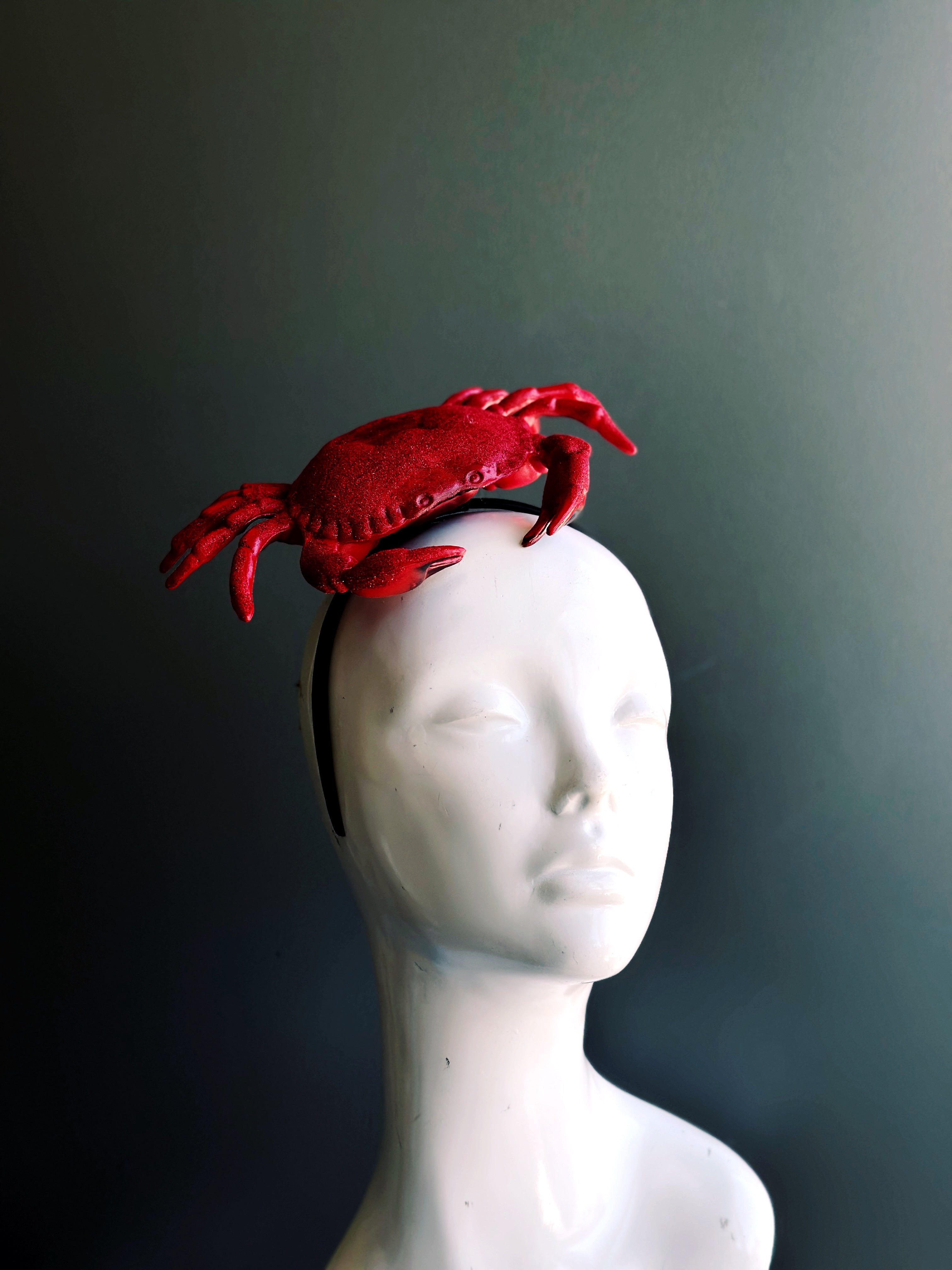 Unique red crab fascinator on a sleek headband, ideal for ocean-inspired fashion, seafood festivals, and statement looks.