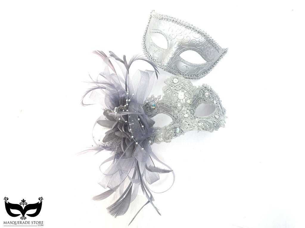 Silver mask set including one with scrollwork and another adorned with lace, rhinestones, and feathers, ideal for formal events and parties.