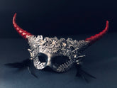 Metallic flower masquerade mask with spiral horns in red and silver.