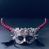 Silver and red gothic floral horn masquerade mask with black feathers