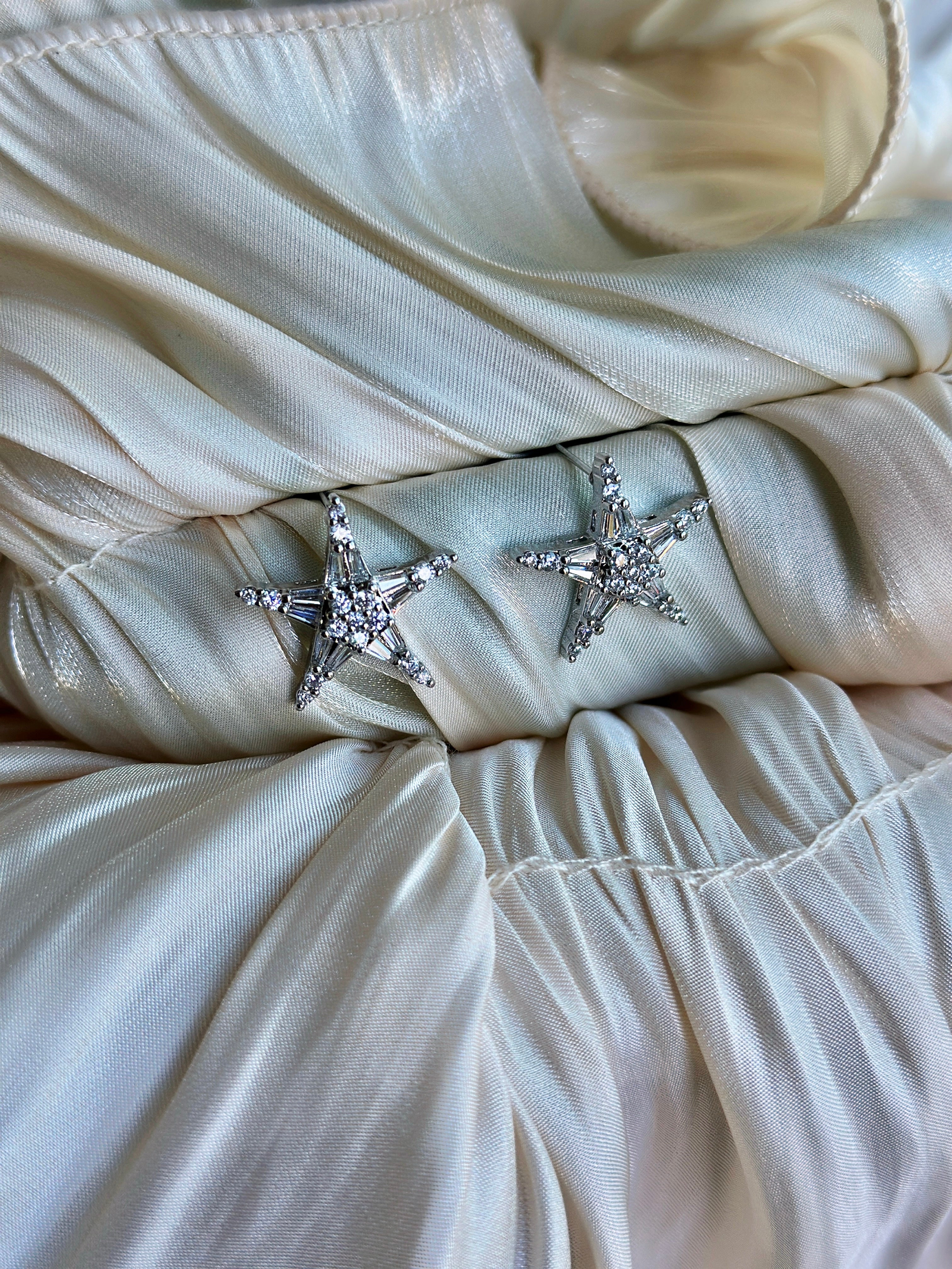 Star-shaped earrings with sparkling crystal embellishments.