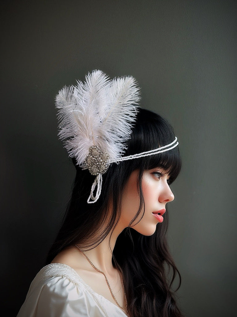 White feather 1920s flapper headband with pearls and rhinestones, perfect for Gatsby-themed parties and weddings.