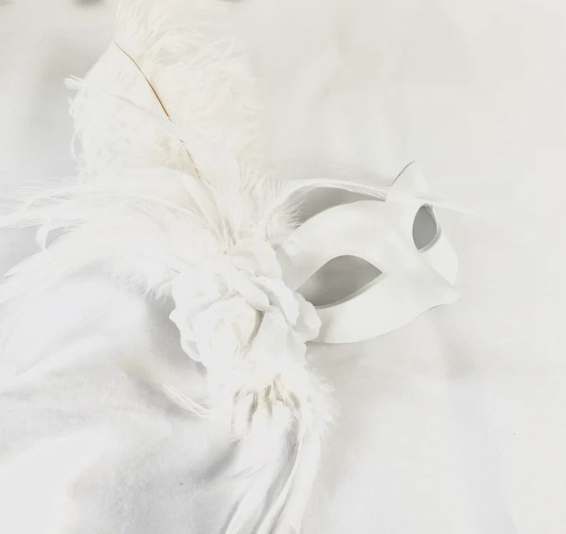 White feather masquerade mask with rose floral accent for women.