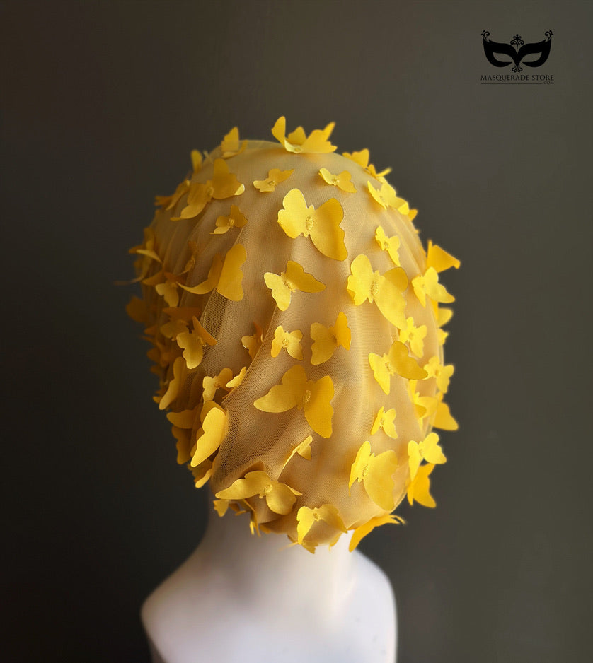 Yellow butterfly face veil mask with dimensional butterfly appliqués attached to a sheer mesh hood, creating a couture-inspired avant garde fashion accessory for runway shows, festivals, cosplay, theatrical performances, and artistic photoshoots.