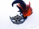 Black venetian mask with red and black feathers
