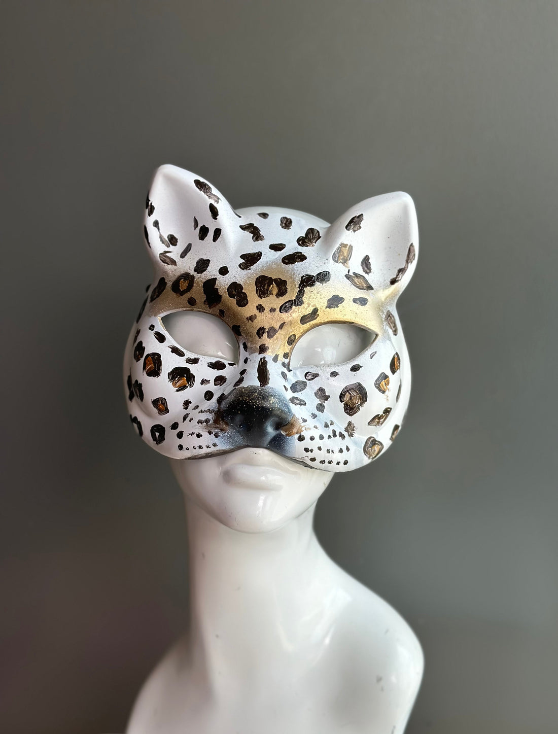 Brown and white cat masquerade mask.