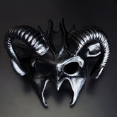 Black ram horn fantasy masquerade mask with sculpted curved horns and metallic black finish, designed for cosplay, Halloween costumes, gothic events, masquerade balls, theatrical productions, and fantasy-themed parties.