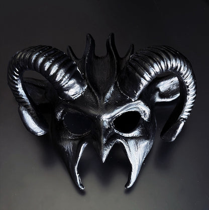 Black ram horn fantasy masquerade mask with sculpted curved horns and metallic black finish, designed for cosplay, Halloween costumes, gothic events, masquerade balls, theatrical productions, and fantasy-themed parties.