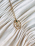gold gemini zodiac pendant necklace with emerald gemstone