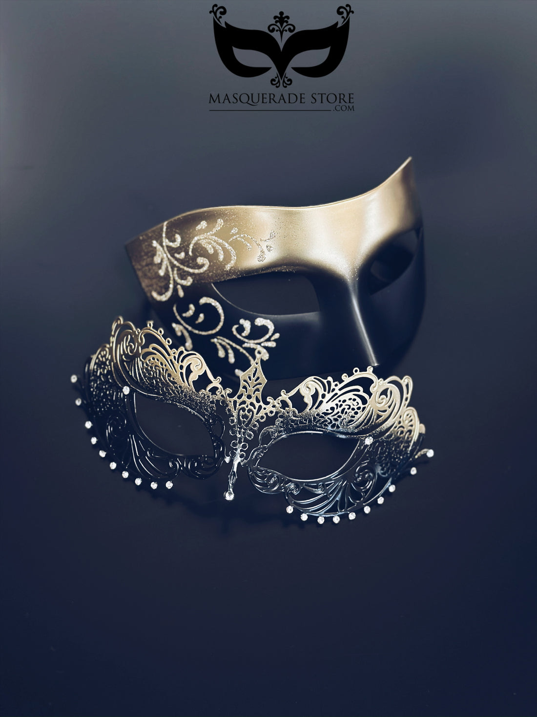 Gold and black with gold filigree mask for men and a gold ombre laser cut metal mask with rhinestones for women.