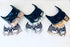 Set of three metallic bat-themed couples masquerade masks in rose gold, silver, and gold accents, featuring dramatic horned men’s masks and intricate bat-wing women’s masks, perfect for fantasy balls and themed events.