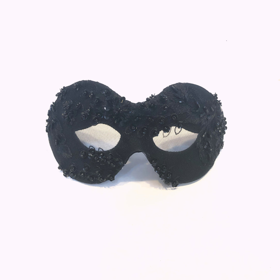 Black masquerade mask with sequin and bead detailing.