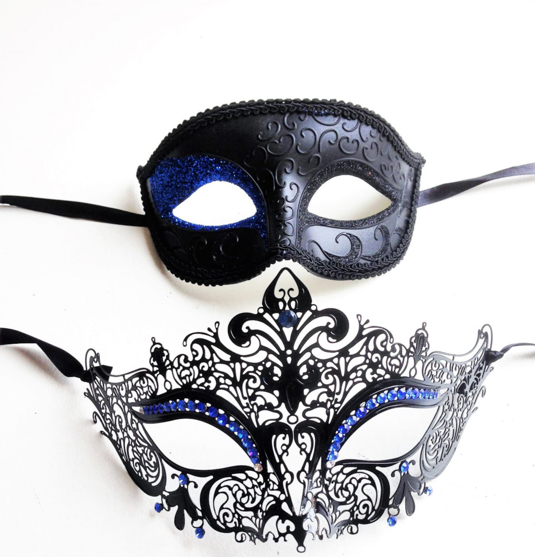 Elegant black and blue couples masquerade mask set with glitter, rhinestones, and filigree detail.