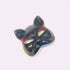 Black cat masquerade mask with red glitter accents around the eyes.