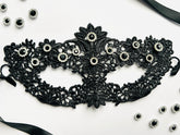 Black lace masquerade mask with black crystal rhinestones for moon ball and formal gala events.