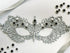 Silver lace masquerade mask with black crystal rhinestones for gala parties and Venetian formal events.