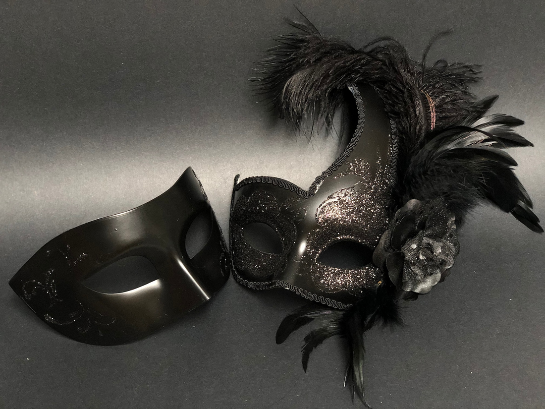 Elegant black couples masquerade mask set with feathered women’s mask and men’s classic mask