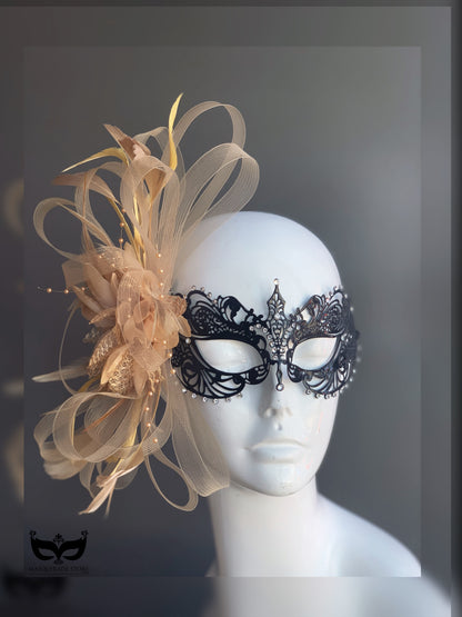 Black filigree masquerade mask with champagne gold feathers, tulle, and crystals for masquerade ball, prom, or Mardi Gras.