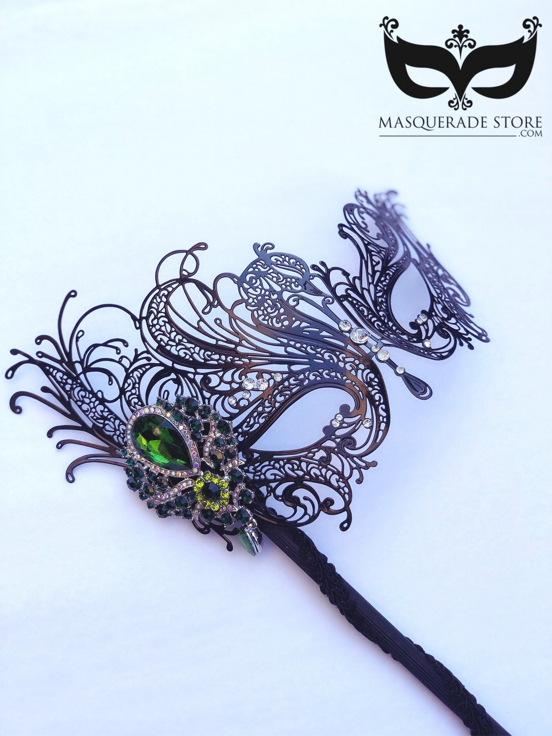 Venetian black filigree masquerade mask on stick with rhinestones and emerald green gemstone.