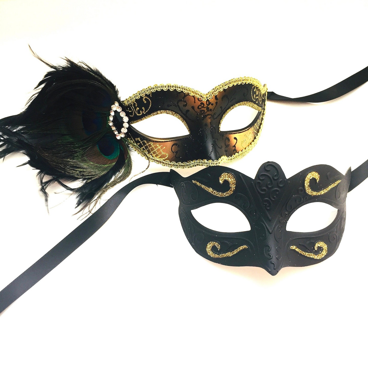 Black and gold couples masquerade masks with rhinestones and peacock feathers, designed for Venetian balls and elegant events.