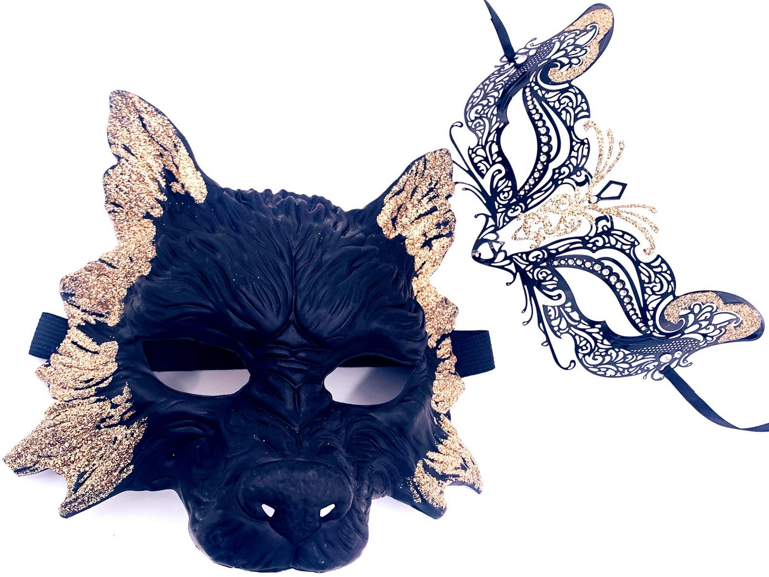 Elegant black and gold couples masquerade mask set with bold men’s mask and delicate filigree women’s mask.
