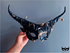 Black horn masquerade mask entwined with gold snakes, Medusa-inspired for gothic fantasy and Halloween.