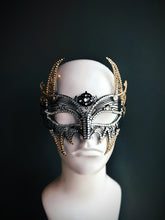 Gold horn masquerade mask in black with dramatic curves and filigree for fantasy ball or Halloween costume
