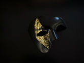 Men’s black and gold Venetian half-face masquerade mask with foil accents, perfect for prom, Halloween, and elegant costume parties.