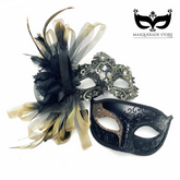 Black and gold couples masquerade mask set with men’s glitter mask and ornate women’s lace feather mask with rhinestones.