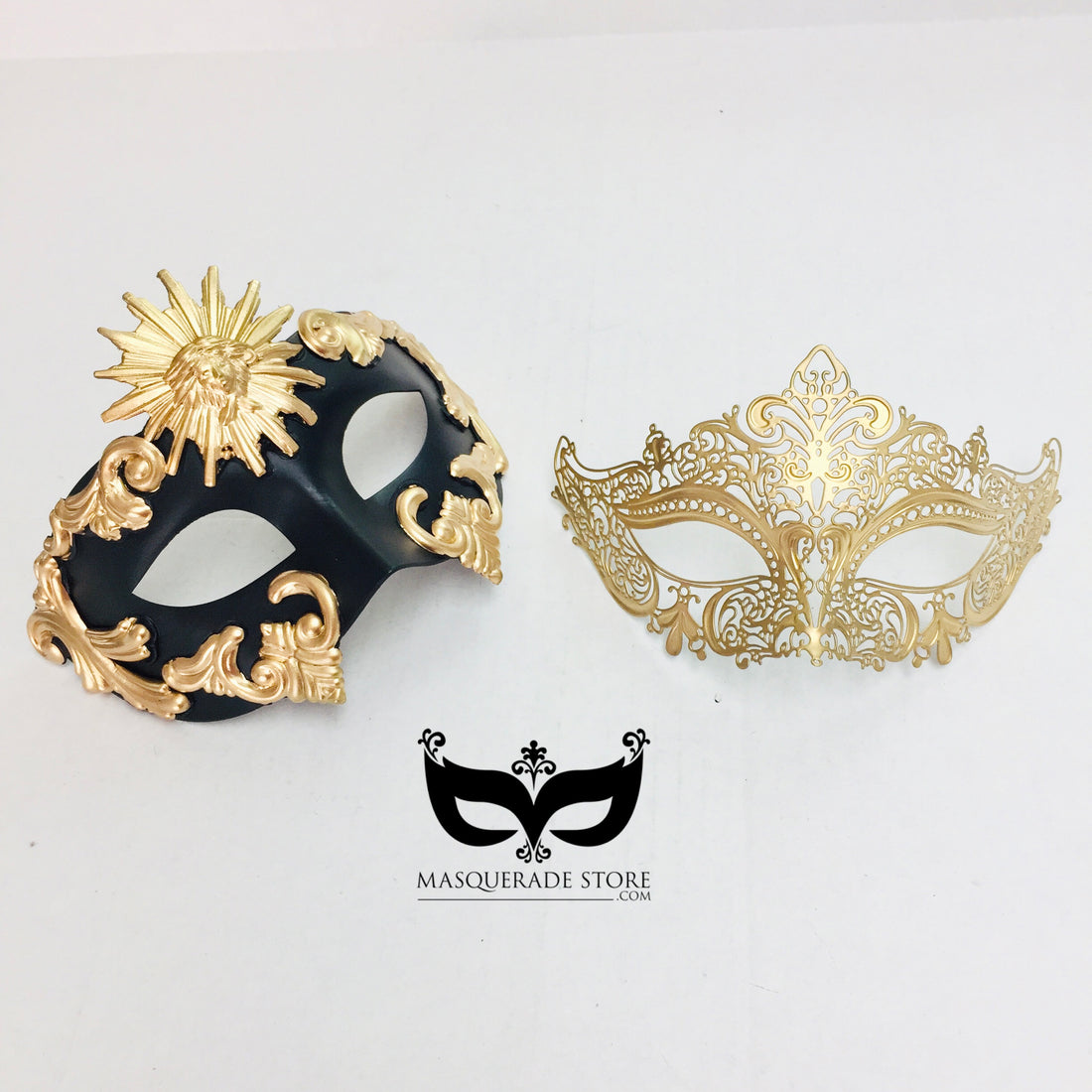 Black and gold couples masquerade mask set featuring a men’s baroque sun mask and a women’s golden filigree mask.