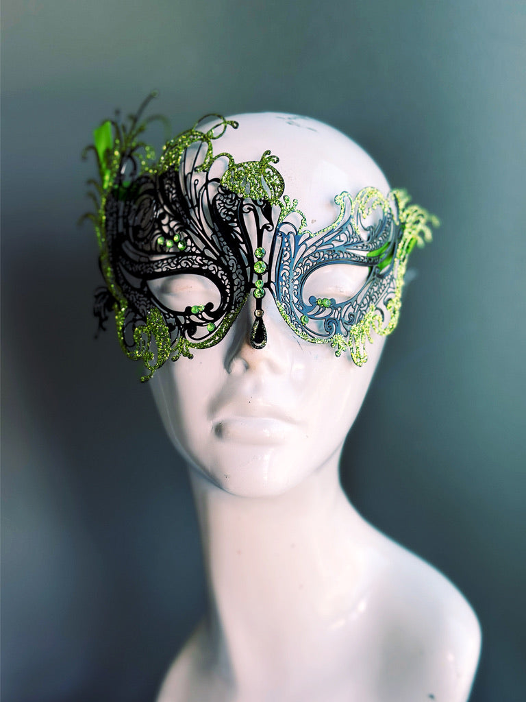 Elegant swan-themed masquerade mask in black metal and green details for costume parties