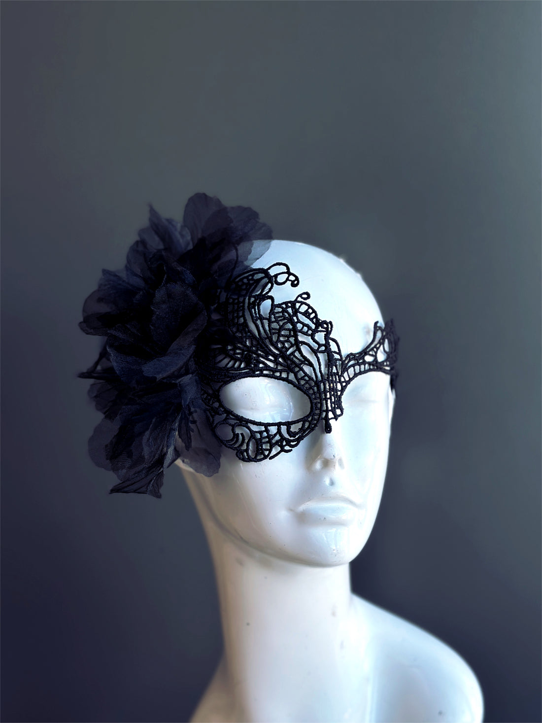 Black lace masquerade mask with large fabric flower accent, elegant Gothic party mask for women, perfect for Halloween or masquerade ball.