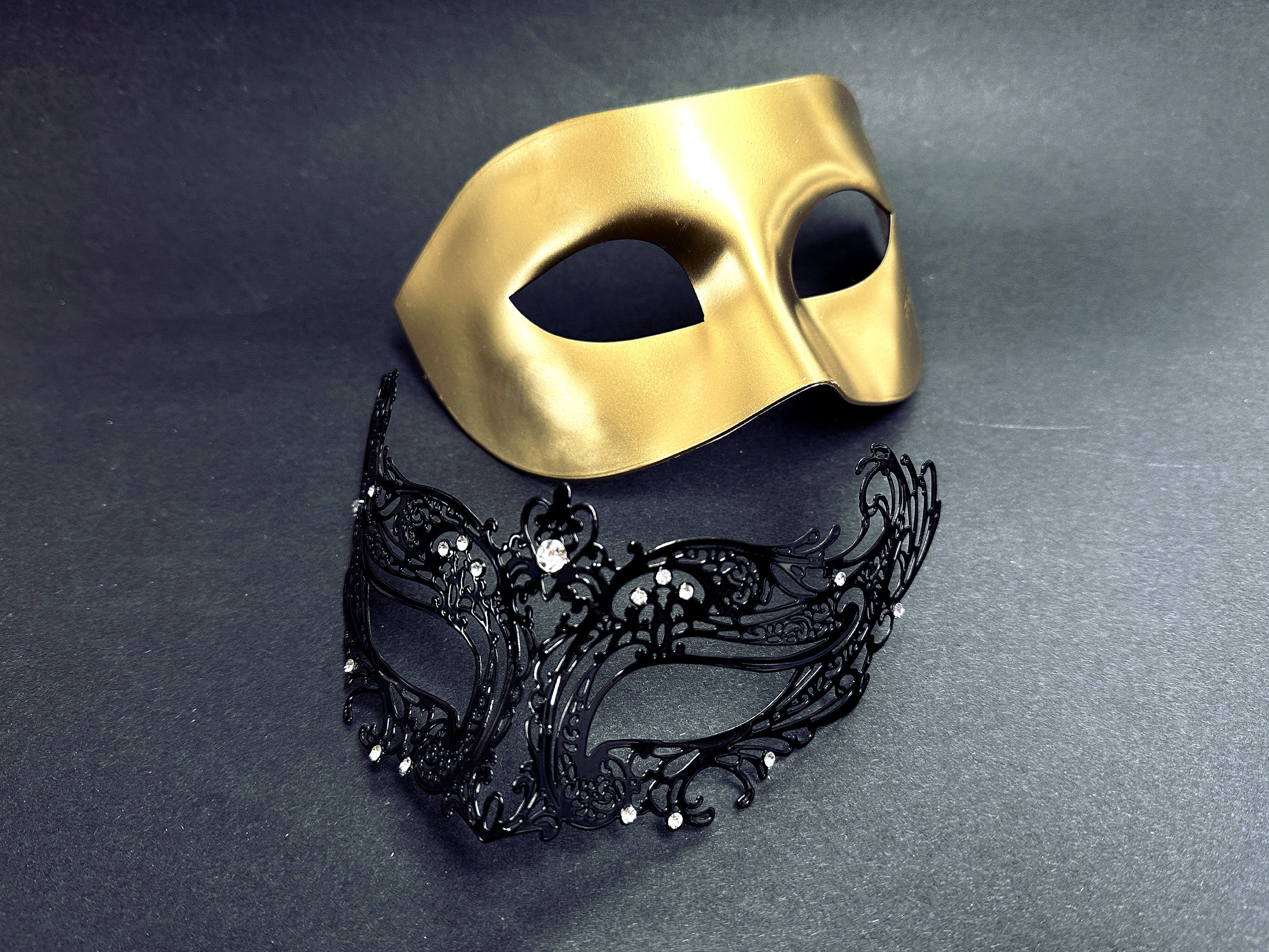 Elegant gold and black couples masquerade masks with crystal details, perfect for masquerade balls, prom, and Halloween.