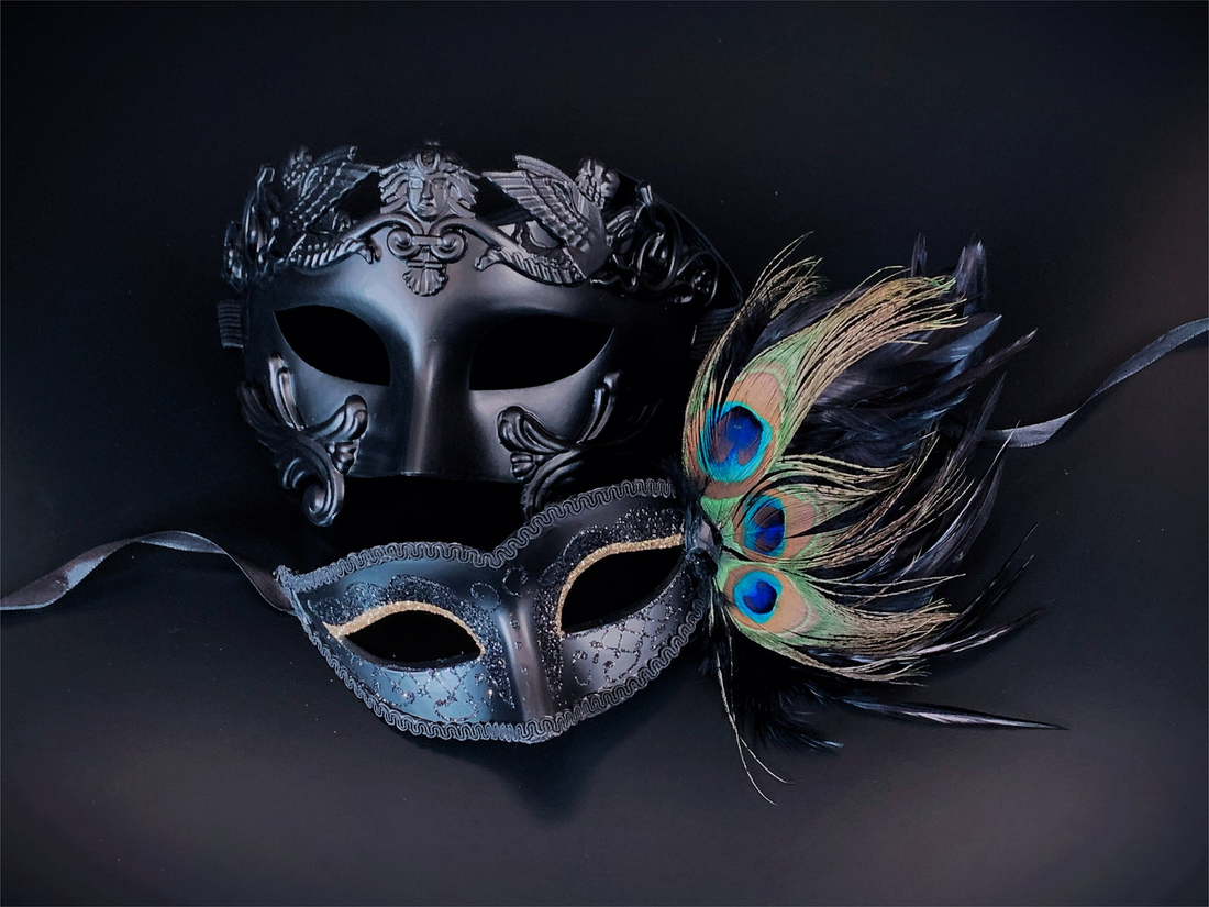 Elegant black masquerade couples mask set with sculpted design and peacock feather accents.
