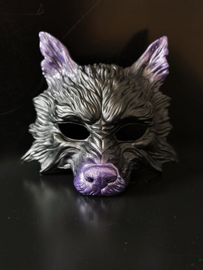 Black and purple wolf masquerade mask with sculpted details for costume and cosplay events.