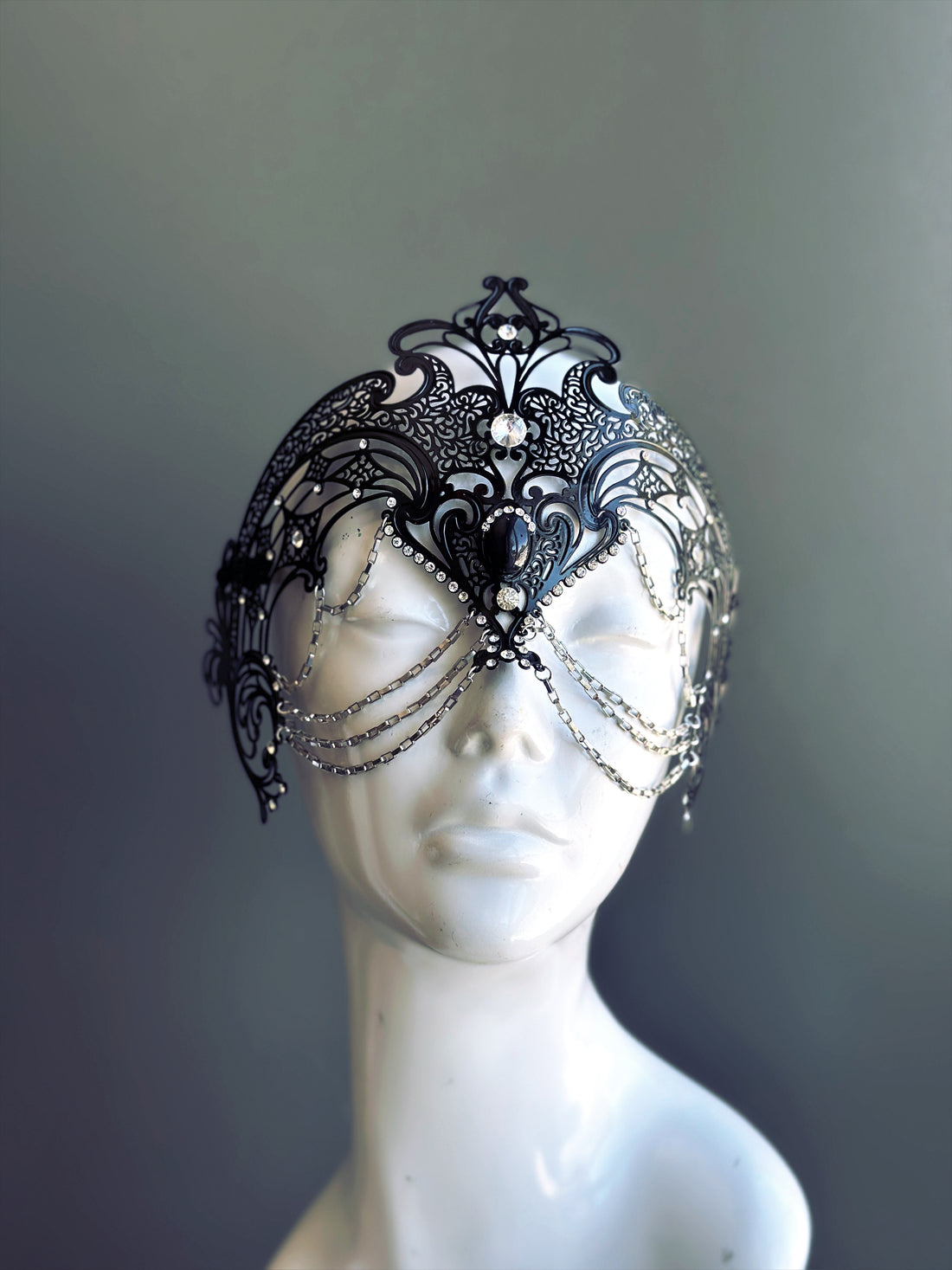 Ornate gothic masquerade crown mask with draped chain accents
