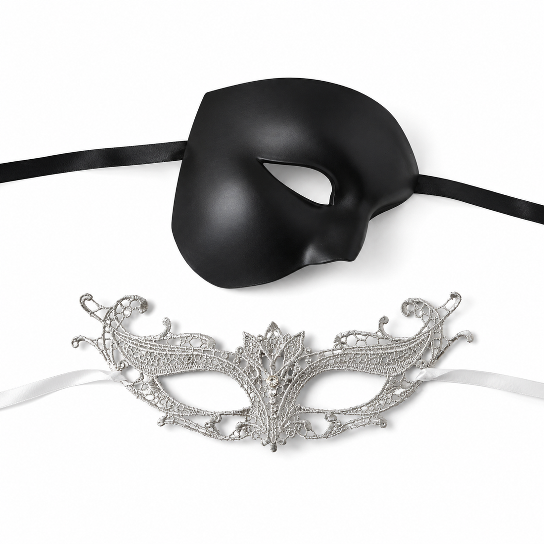 Black silver couples masquerade mask set with smooth black phantom-style men’s mask and ornate silver lace women’s mask for gala and formal events.