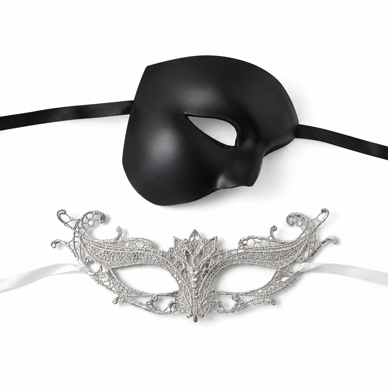 Black silver couples masquerade mask set with smooth black phantom-style men’s mask and ornate silver lace women’s mask for gala and formal events.