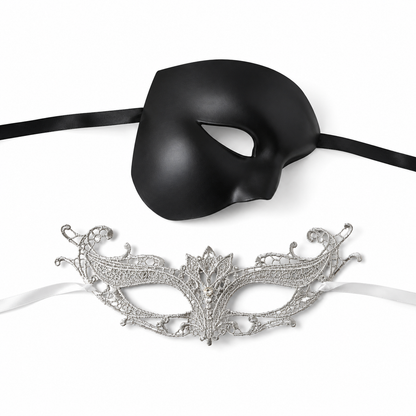 Black silver couples masquerade mask set with smooth black phantom-style men’s mask and ornate silver lace women’s mask for gala and formal events.