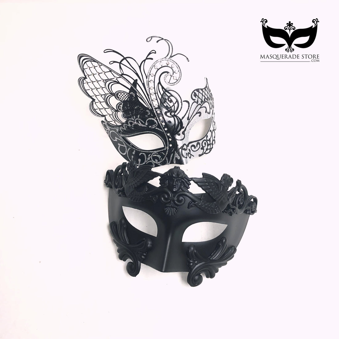 Black and silver Venetian-style couples masquerade masks set with butterfly filigree women’s mask and baroque men’s mask.